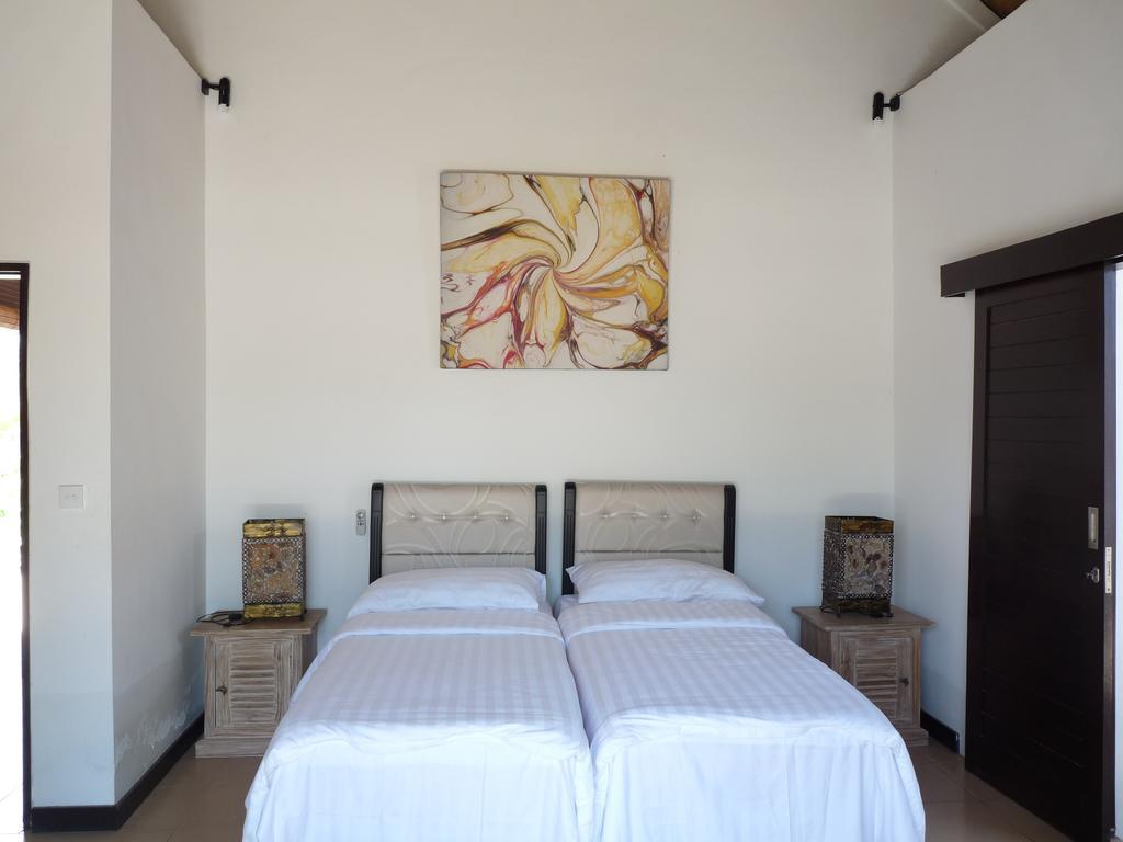 Taman Dewi Sri Villa Et Bungalow Pemuteran Szoba fotó